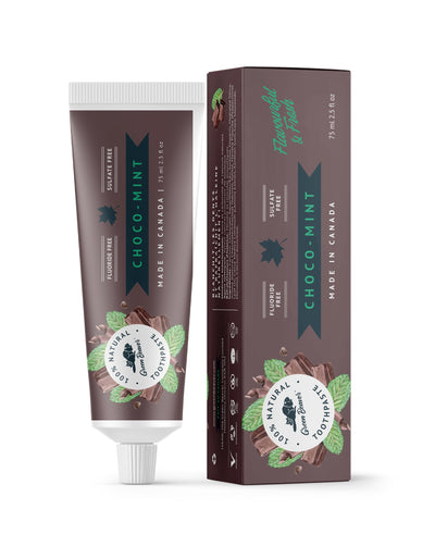 A tube of chocolate mint natural toothpaste from Green Beaver is placed vertically next to its box on a white background.