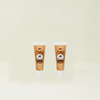 Two maple natural lip balms are on a beige background