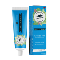 A tube of frosty mint natural toothpaste from Green Beaver is placed vertically next to its box on a white background.