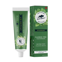 A tube of spearmint natural toothpaste from Green Beaver is placed vertically next to its box on a white background.