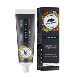 A tube of star anise natural toothpaste from Green Beaver is placed vertically next to its box on a white background.