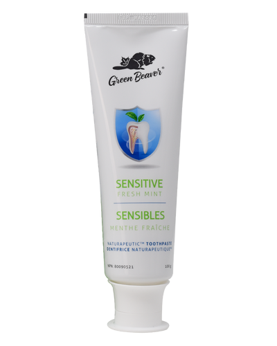 A white tube of sensitive teeth  flouride-free toothpaste in fresh mint flavour by Green Beaver