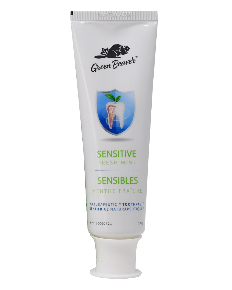 A white tube of sensitive teeth  flouride-free toothpaste in fresh mint flavour by Green Beaver