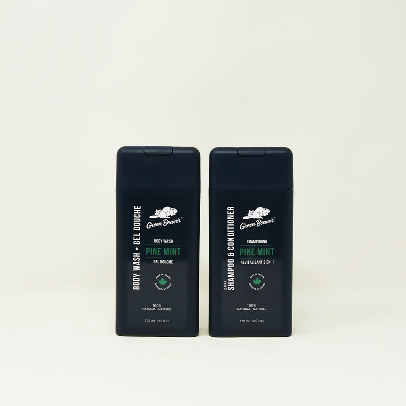 Two dark green bottles of Pine Mint scent products for the Men&